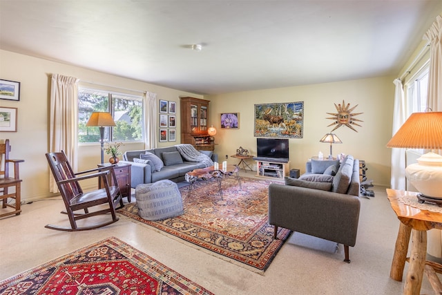 living room featuring plenty of natural light and baseboards