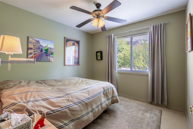 bedroom featuring baseboards and a ceiling fan