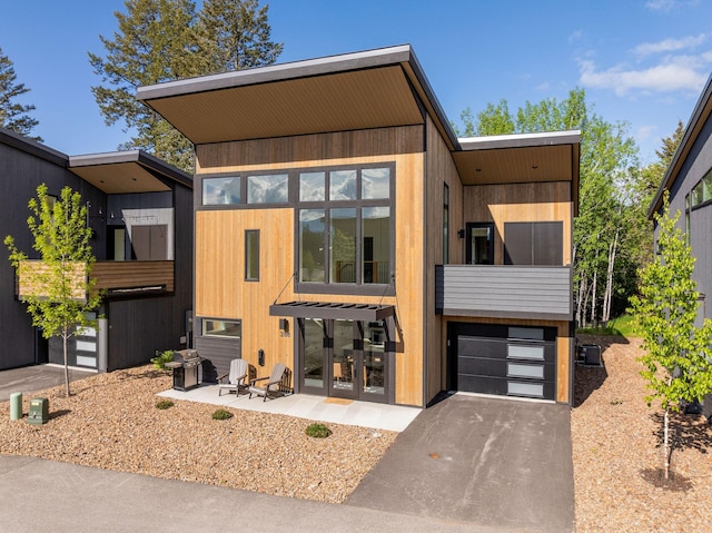 288 Boulders Rd Unit B21, Whitefish, MT 59937 - contemporary house with asphalt driveway and a garage