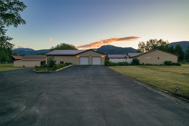 4901 Hoblitt Ln S, Florence, MT 59833 - single story home featuring a mountain view, a garage, asphalt driveway, and a yard