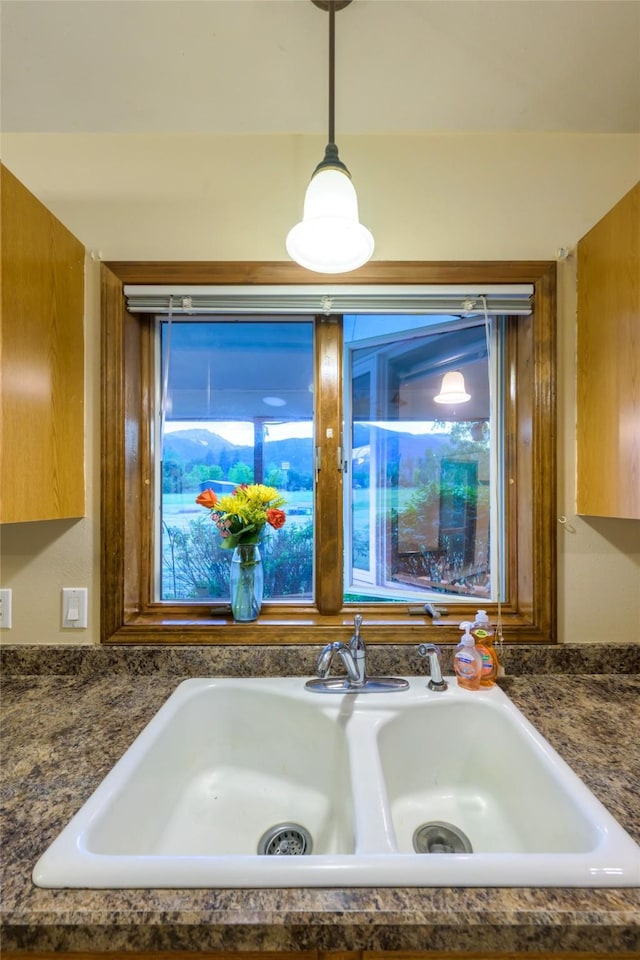 4901 Hoblitt Ln S, Florence, MT 59833 - kitchen view of dark countertops, pendant lighting, and a sink