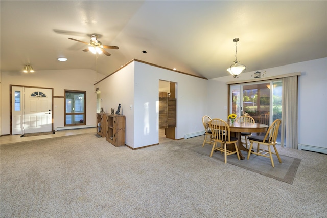 4901 Hoblitt Ln S, Florence, MT 59833 - carpeted dining room featuring vaulted ceiling, a baseboard heating unit, a ceiling fan, baseboards, and baseboard heating