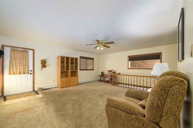 4901 Hoblitt Ln S, Florence, MT 59833 - living area with carpet floors, ceiling fan, a baseboard heating unit, and baseboards