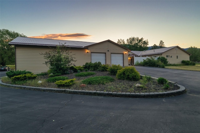 4901 Hoblitt Ln S, Florence, MT 59833 - view of front of property featuring a garage, driveway, and metal roof