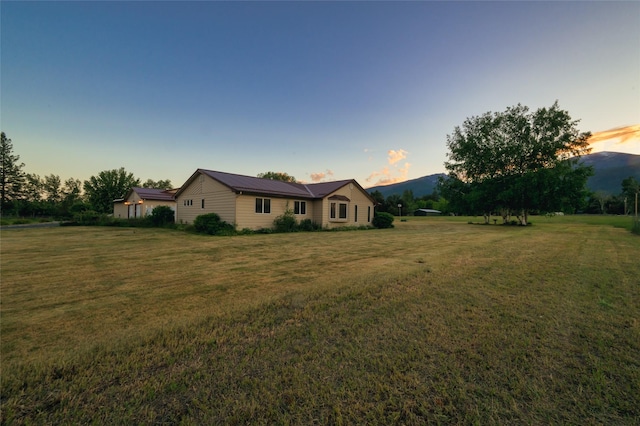 4901 Hoblitt Ln S, Florence, MT 59833 - view of front facade with a yard and metal roof