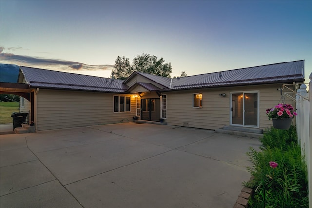 4901 Hoblitt Ln S, Florence, MT 59833 - back of house at dusk with metal roof