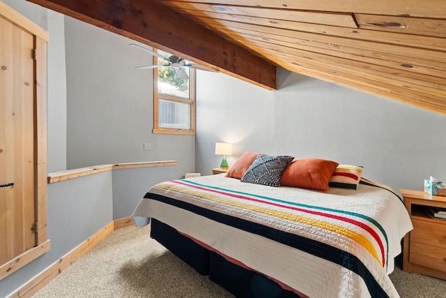 bedroom featuring lofted ceiling with beams, carpet floors, and baseboards