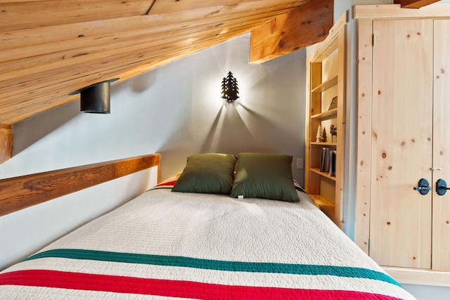 bedroom with wood ceiling and a closet