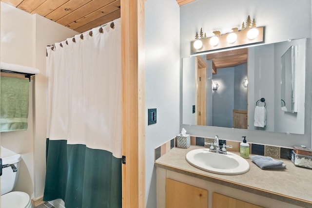 bathroom with toilet, wooden ceiling, a shower with curtain, and vanity