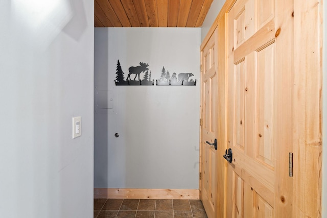 corridor with wooden ceiling and baseboards