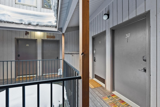 property entrance featuring board and batten siding