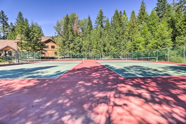 view of sport court with fence