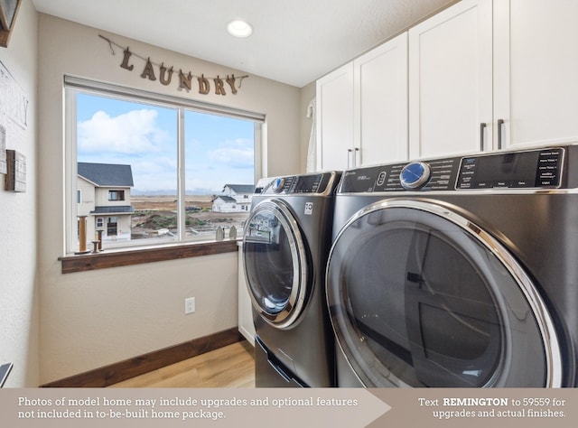 washroom with washing machine and dryer, recessed lighting, baseboards, light wood-style floors, and cabinet space