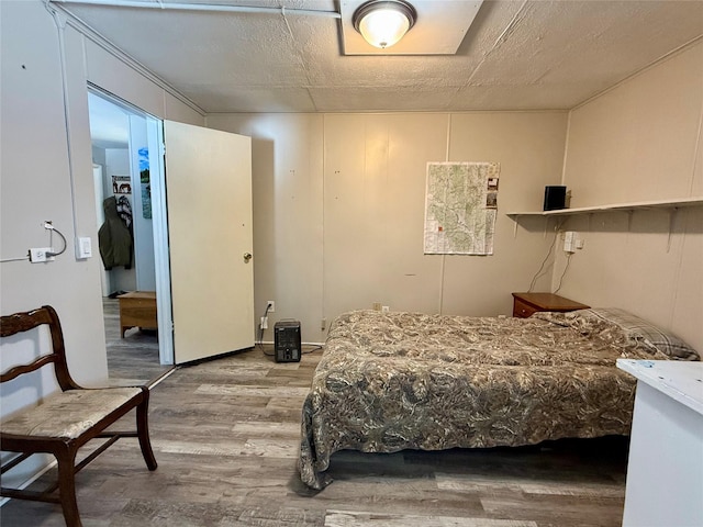 bedroom featuring light wood-style floors