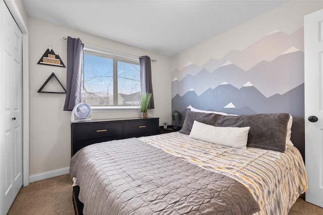 bedroom featuring a closet, carpet, and baseboards