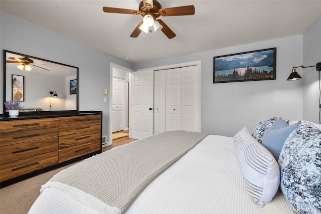 bedroom with a closet, a ceiling fan, and light colored carpet