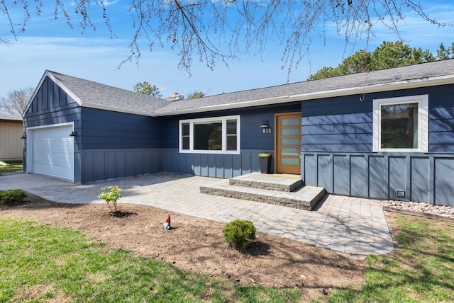 613 Continental Way, Missoula, MT 59803 - ranch-style home featuring a garage, a chimney, and a shingled roof