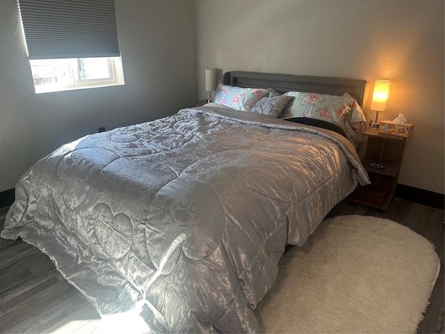 bedroom with wood finished floors