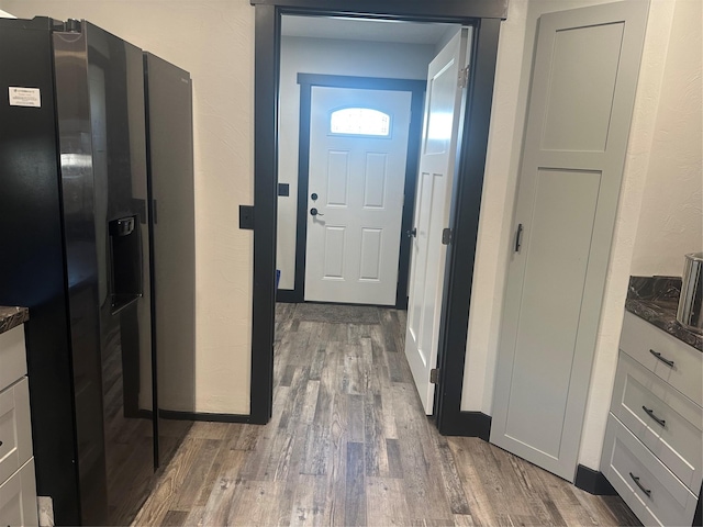 hallway with dark wood-type flooring