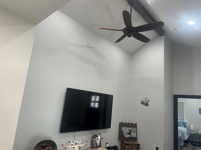 room details featuring beam ceiling and ceiling fan