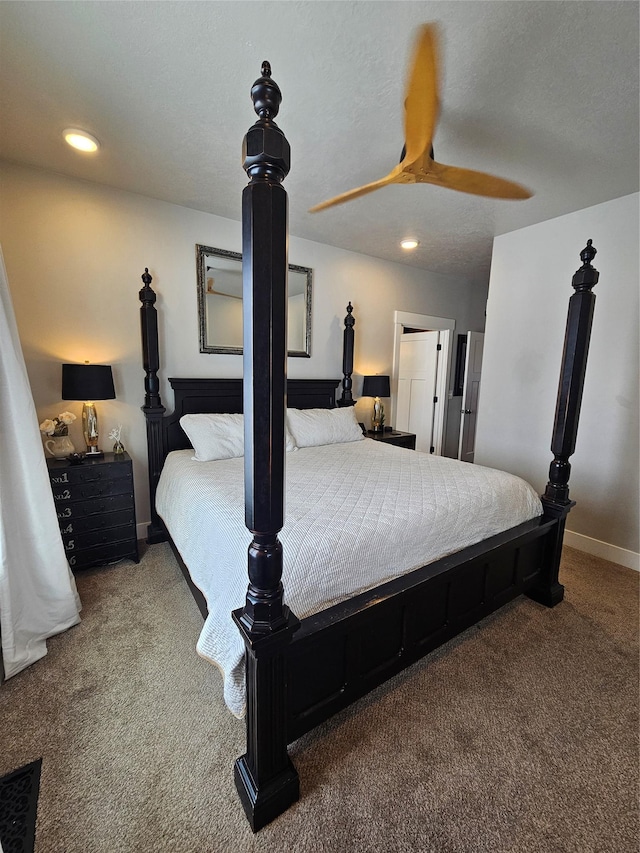 carpeted bedroom with a textured ceiling, baseboards, a ceiling fan, and recessed lighting