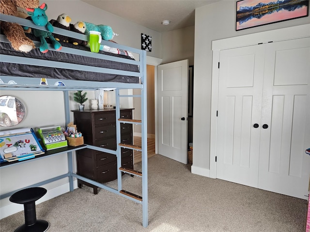 carpeted bedroom featuring a closet