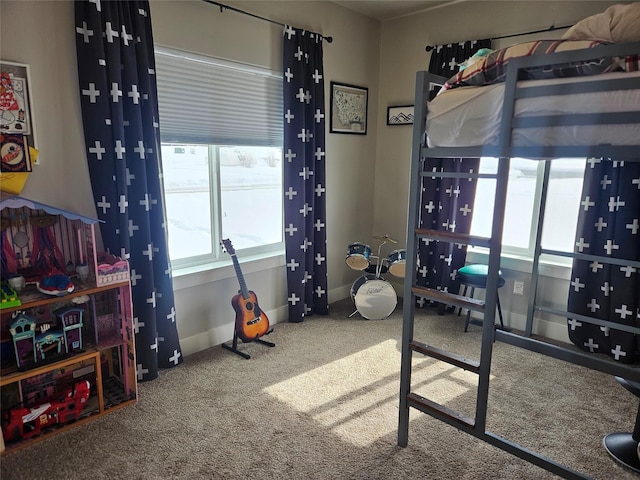 bedroom featuring carpet flooring and baseboards