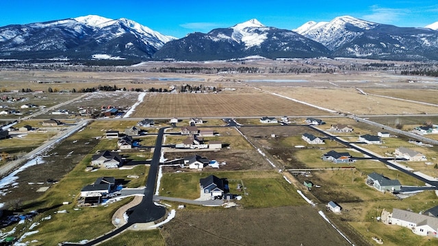 birds eye view of property with a mountain view