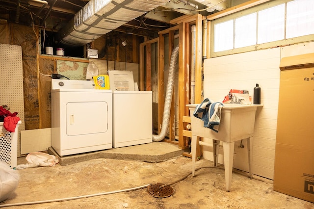 below grade area featuring washer and clothes dryer