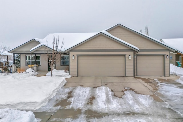 ranch-style home with a garage and concrete driveway