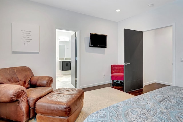 bedroom featuring recessed lighting, dark wood-style flooring, connected bathroom, and baseboards