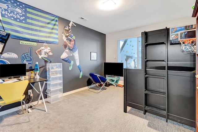 office featuring light carpet, visible vents, and baseboards