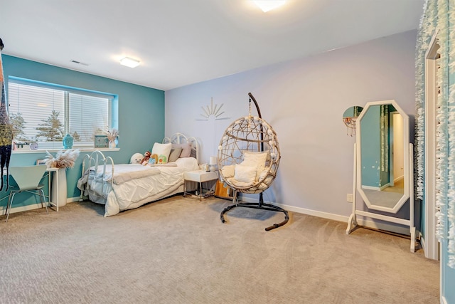 carpeted bedroom with visible vents and baseboards