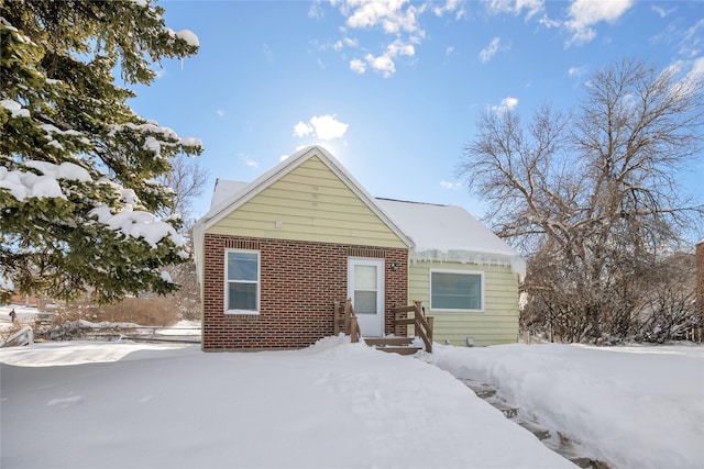 view of front of home featuring brick siding