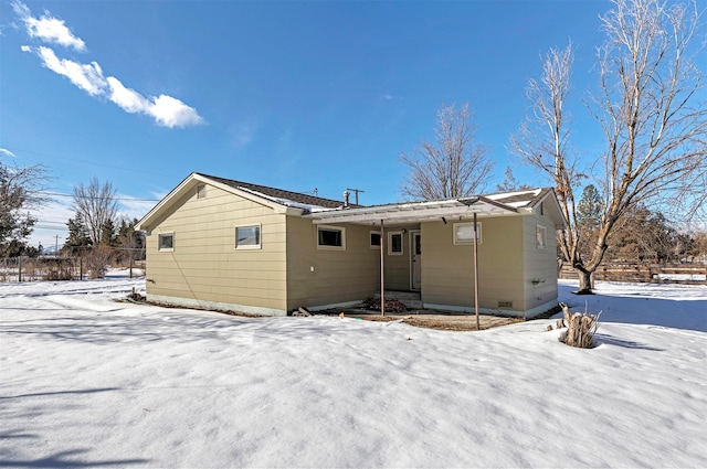 view of snow covered house