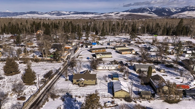 snowy aerial view with a mountain view