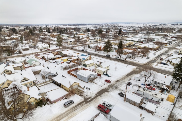 snowy aerial view featuring a residential view