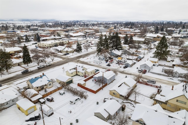 snowy aerial view featuring a residential view