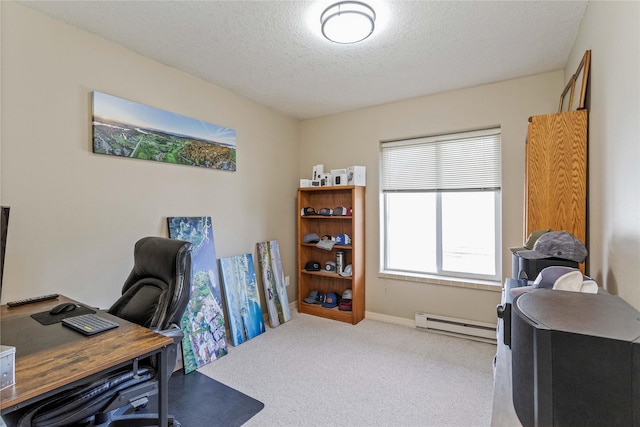 office featuring light carpet, baseboard heating, a textured ceiling, and baseboards