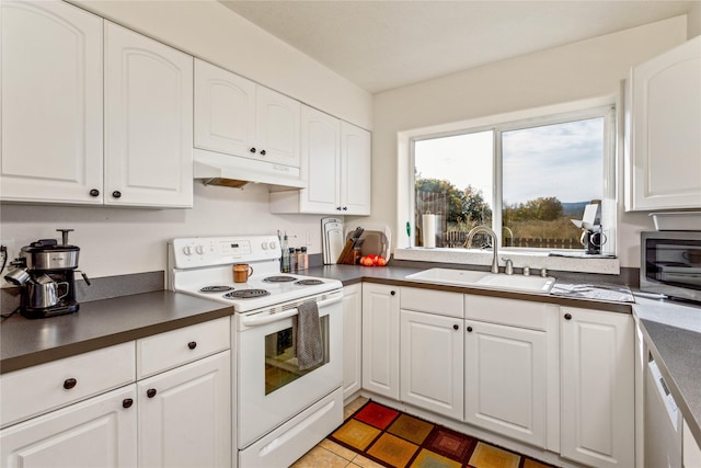 kitchen featuring white range with electric cooktop, dark countertops, white cabinetry, and under cabinet range hood