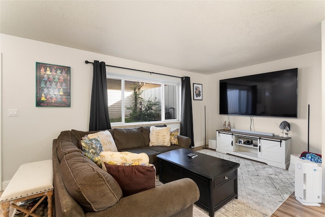 living room featuring light wood-type flooring and baseboards