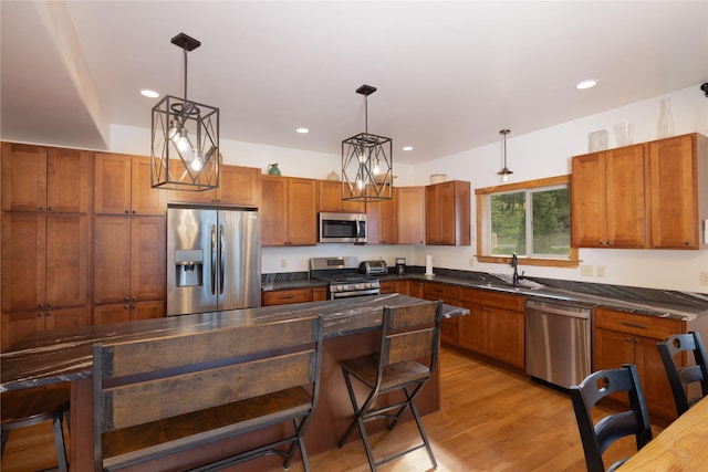 56 Nelson Dr, Rexford, MT 59930 - kitchen featuring appliances with stainless steel finishes, dark countertops, and decorative light fixtures