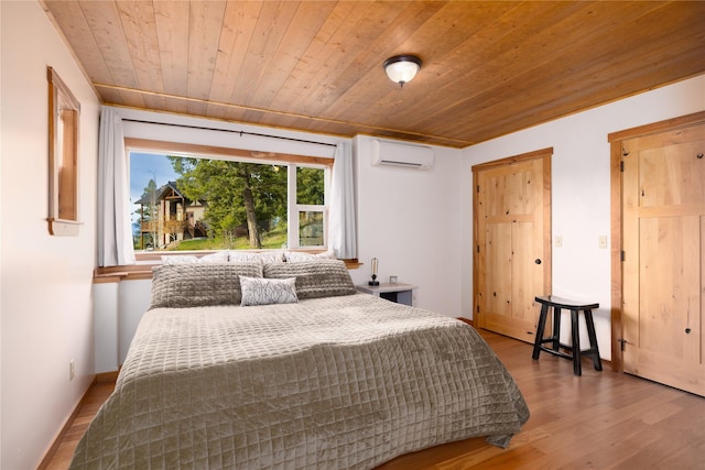 56 Nelson Dr, Rexford, MT 59930 - bedroom with an AC wall unit, wooden ceiling, baseboards, and wood finished floors