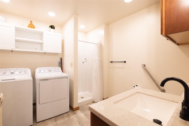 56 Nelson Dr, Rexford, MT 59930 - washroom featuring cabinet space, separate washer and dryer, a sink, and recessed lighting