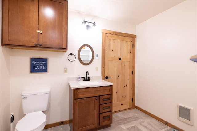 56 Nelson Dr, Rexford, MT 59930 - bathroom with toilet, heating unit, baseboards, and vanity