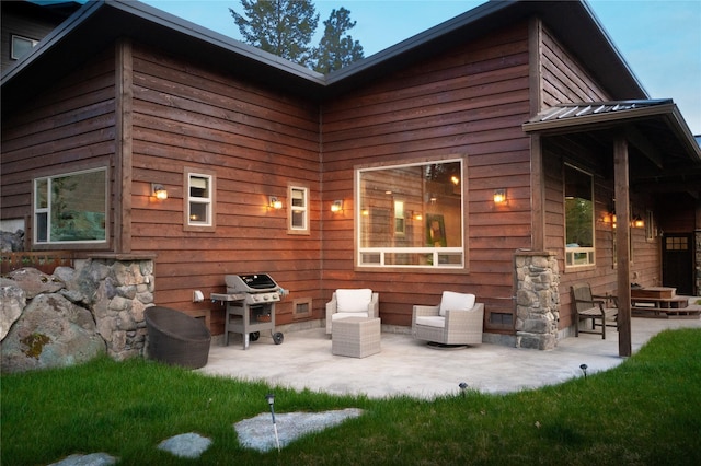 56 Nelson Dr, Rexford, MT 59930 - back of property with metal roof, a patio, and a standing seam roof