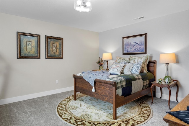 bedroom with carpet flooring, visible vents, and baseboards