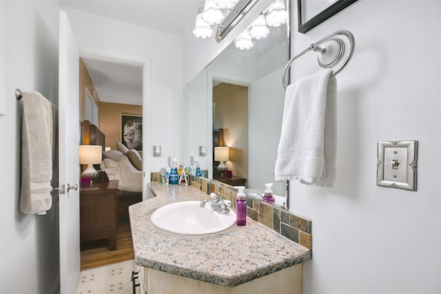 bathroom with vanity and ensuite bathroom