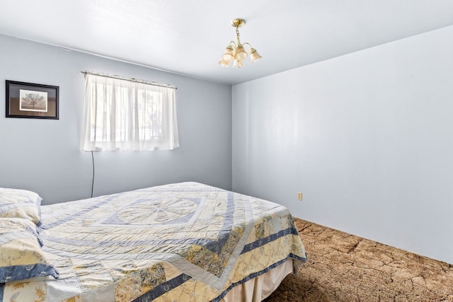 carpeted bedroom with a chandelier