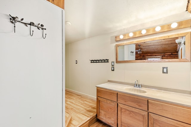 bathroom featuring vanity and wood finished floors